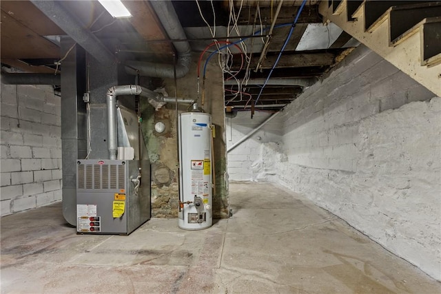 basement featuring gas water heater and heating unit