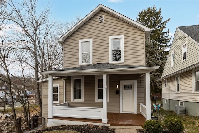 view of front facade with central AC unit and covered porch