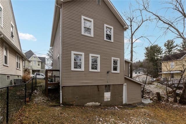 back of property featuring cooling unit