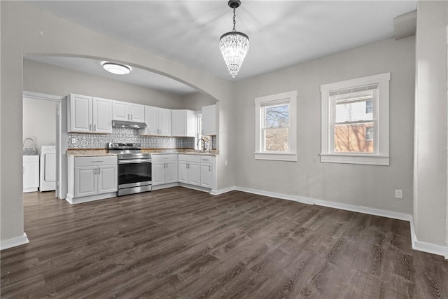 kitchen featuring white cabinetry, sink, dark wood-type flooring, pendant lighting, and stainless steel range with electric cooktop