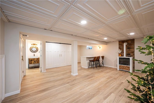 basement featuring light hardwood / wood-style floors