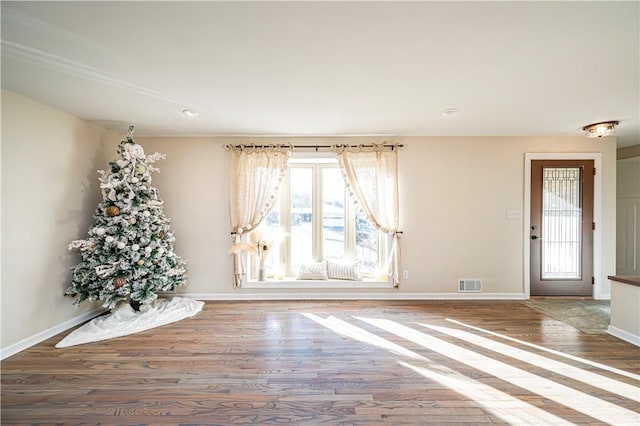 foyer entrance featuring hardwood / wood-style floors