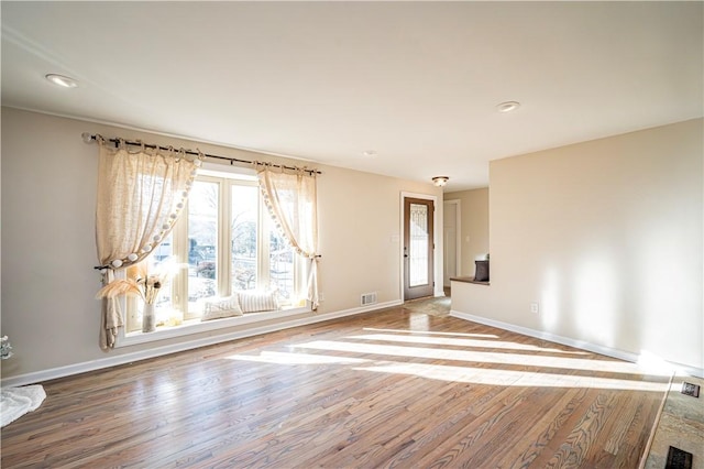 spare room featuring hardwood / wood-style flooring