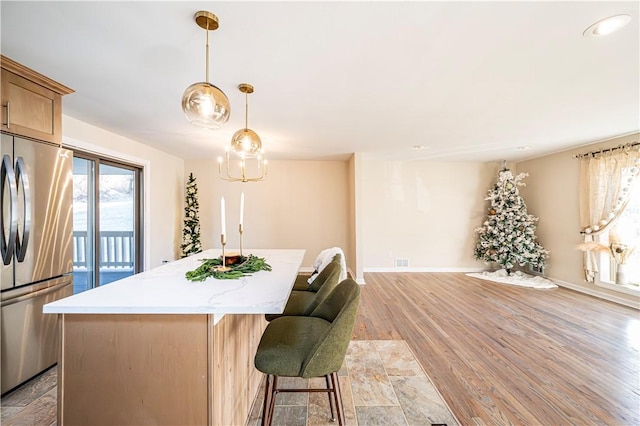 dining area featuring light wood-type flooring