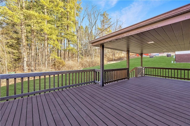 wooden terrace with a lawn