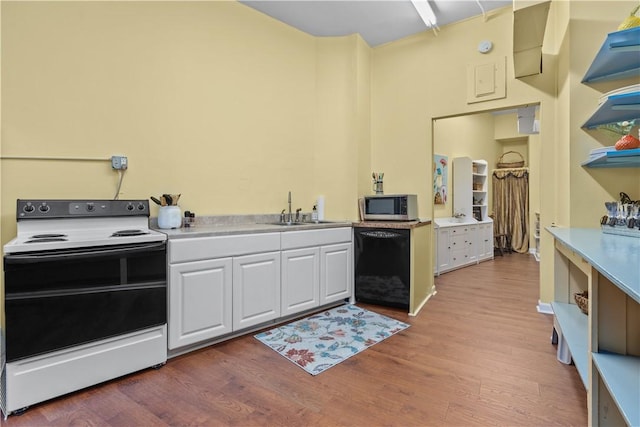 kitchen with white cabinetry, sink, black dishwasher, light hardwood / wood-style flooring, and white range with electric stovetop