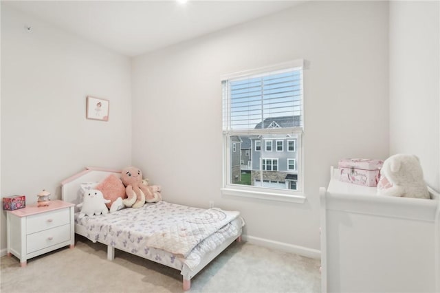 bedroom with light colored carpet