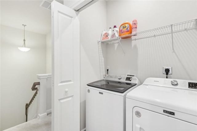 laundry area with washer and clothes dryer