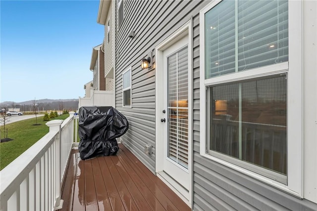 deck featuring area for grilling and a yard