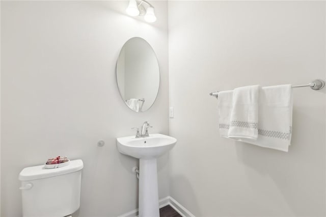 bathroom with toilet and sink