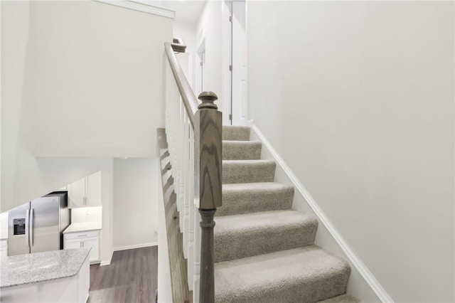 stairs with hardwood / wood-style floors