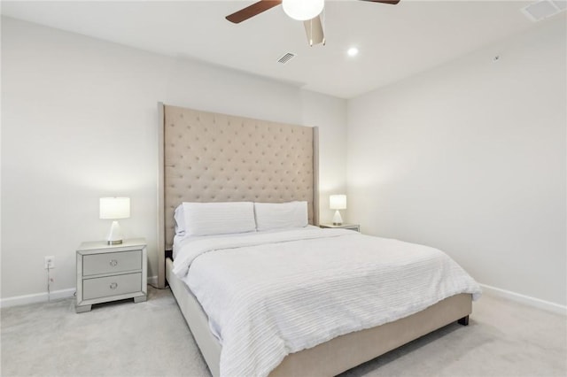 bedroom with ceiling fan and light carpet