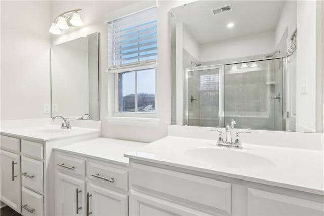 bathroom featuring vanity and walk in shower