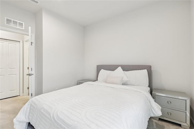 bedroom featuring light colored carpet