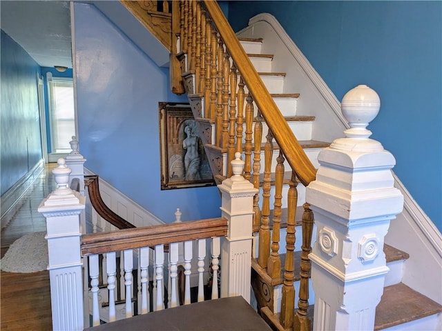 staircase featuring wood-type flooring