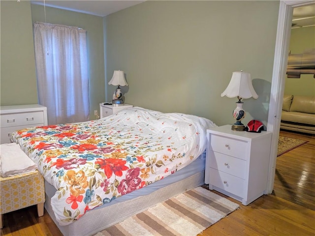 bedroom featuring hardwood / wood-style floors