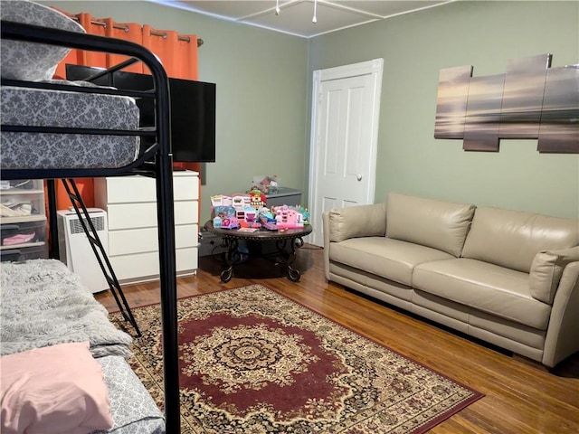 bedroom with wood-type flooring