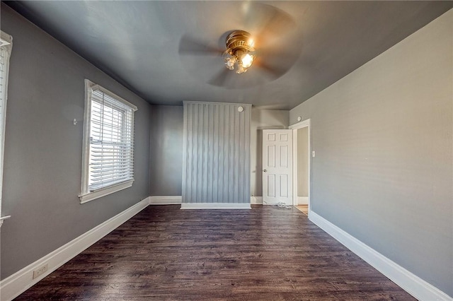 unfurnished room featuring dark hardwood / wood-style flooring and ceiling fan