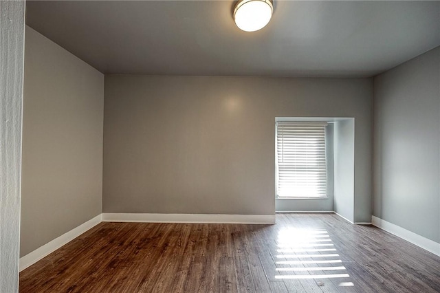 unfurnished room featuring dark hardwood / wood-style floors