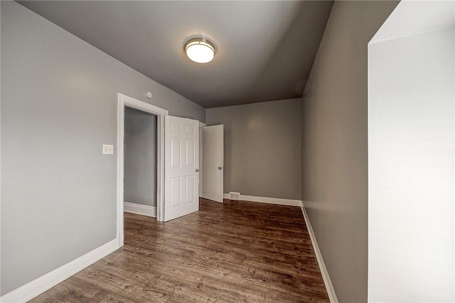 spare room featuring hardwood / wood-style flooring