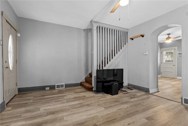 foyer entrance with light hardwood / wood-style flooring and ceiling fan