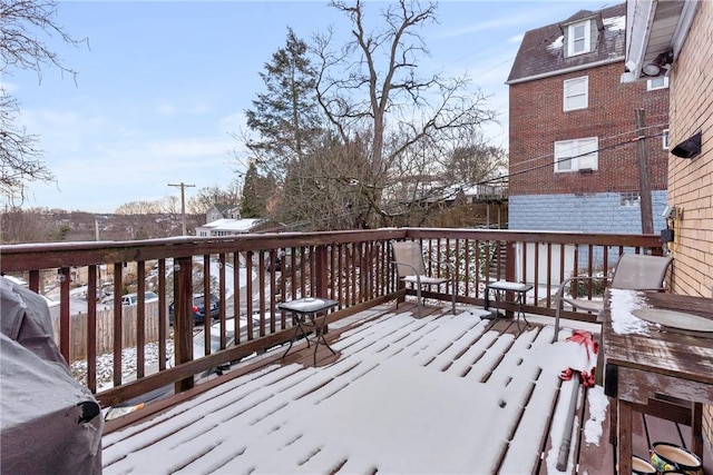 view of snow covered deck