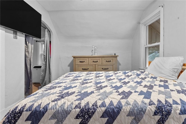 bedroom featuring vaulted ceiling