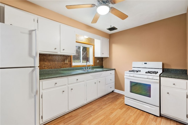 kitchen featuring white cabinetry, sink, tasteful backsplash, white appliances, and light wood-type flooring