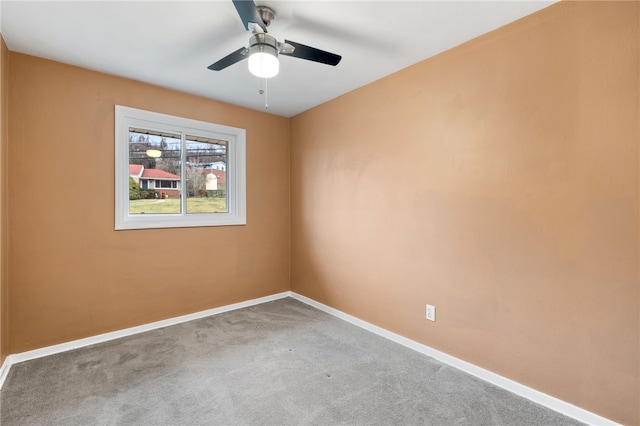 unfurnished room featuring carpet and ceiling fan