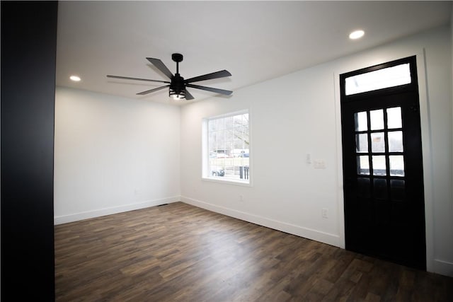 entryway with ceiling fan and dark hardwood / wood-style flooring