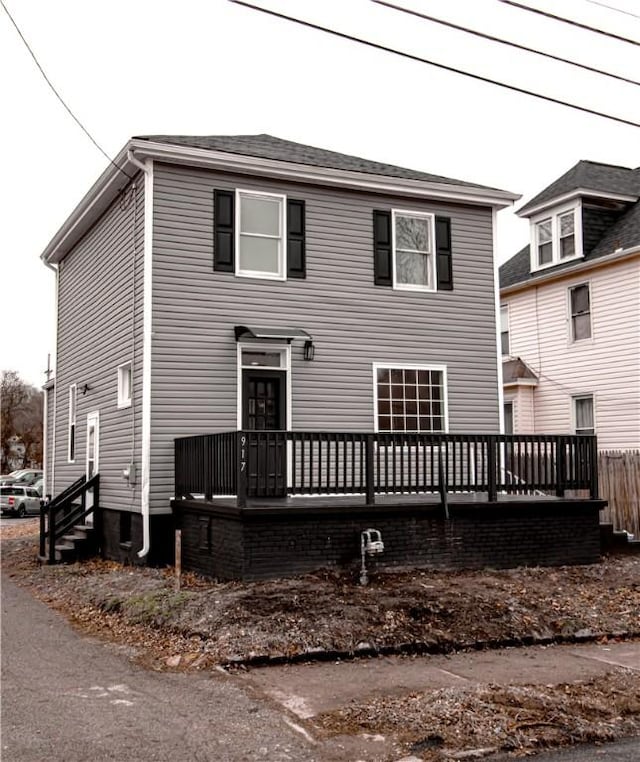 view of front of house with a wooden deck