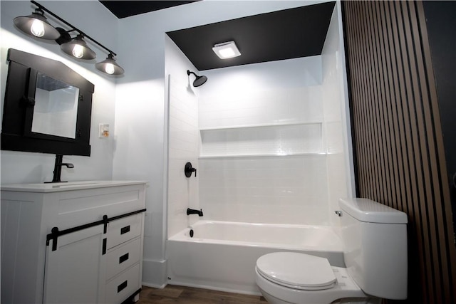 full bathroom with vanity,  shower combination, toilet, and wood-type flooring