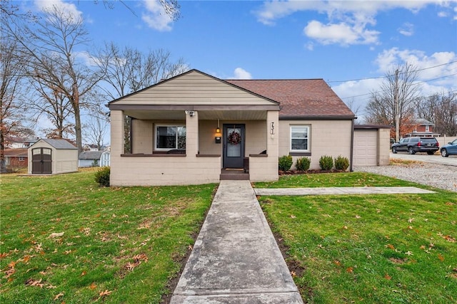 bungalow with a shed, covered porch, and a front yard