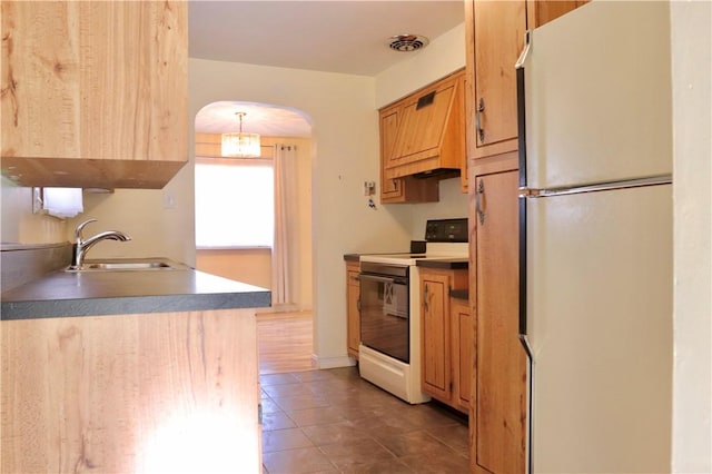 kitchen featuring white appliances, decorative light fixtures, custom exhaust hood, and sink