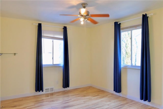 spare room with ceiling fan and light hardwood / wood-style floors