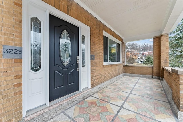 doorway to property with a porch