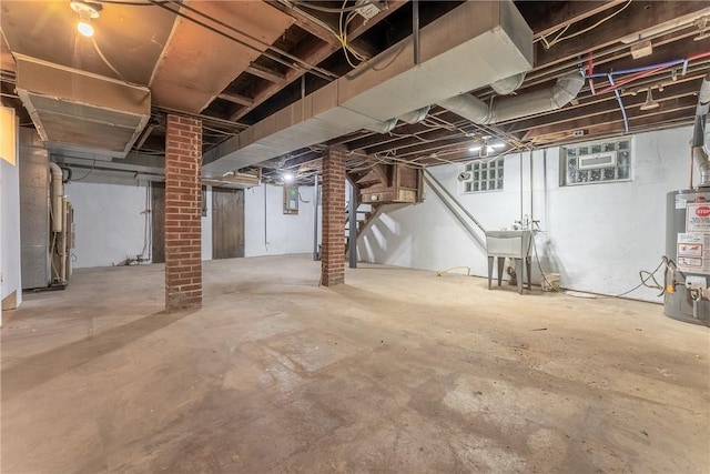 basement with sink and gas water heater