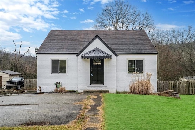 bungalow with a front yard