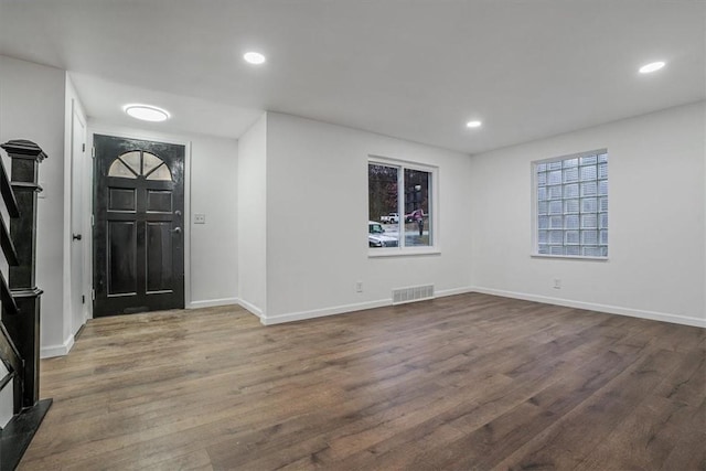 foyer with dark hardwood / wood-style flooring