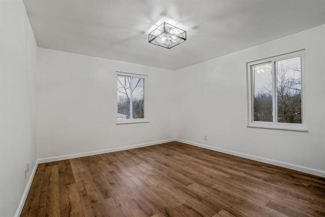 spare room with hardwood / wood-style floors