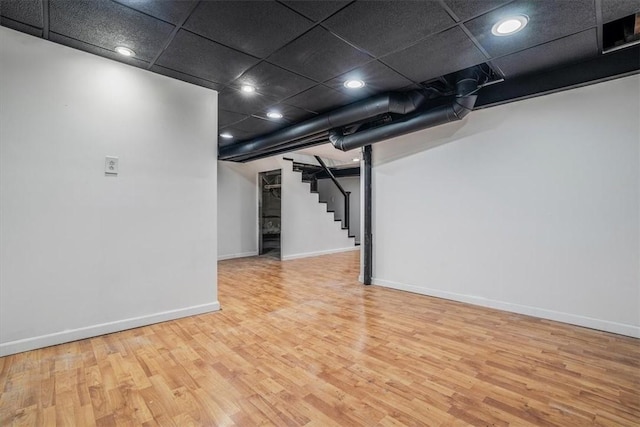 basement featuring hardwood / wood-style floors