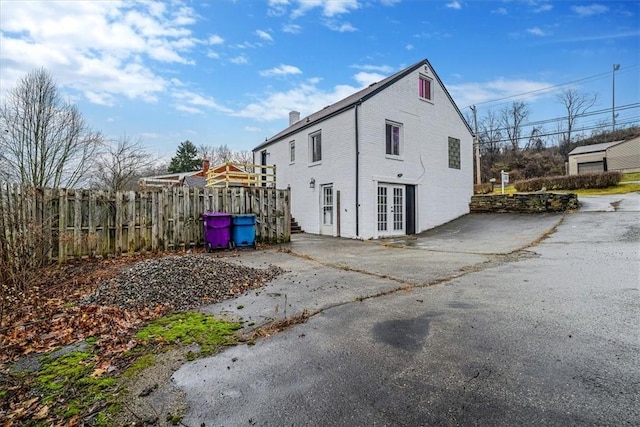 view of side of home with french doors