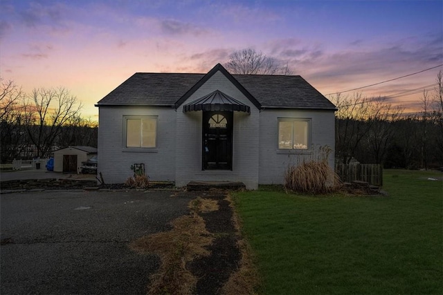 view of front of home with a lawn