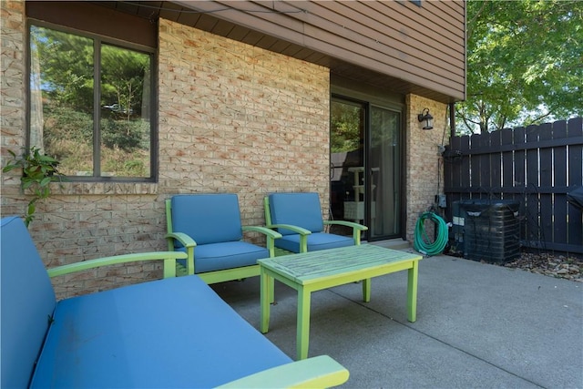 view of patio featuring an outdoor living space and central AC unit