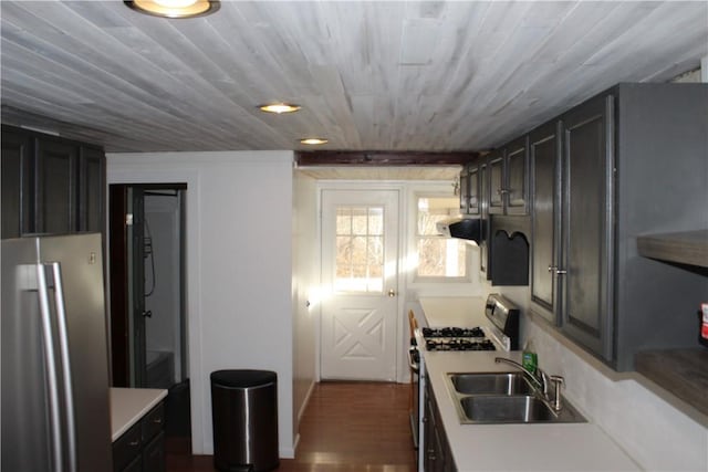 kitchen featuring wooden ceiling, dark wood-type flooring, sink, stainless steel appliances, and extractor fan