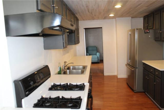 kitchen with sink, wooden ceiling, white range with gas stovetop, ventilation hood, and dark brown cabinets