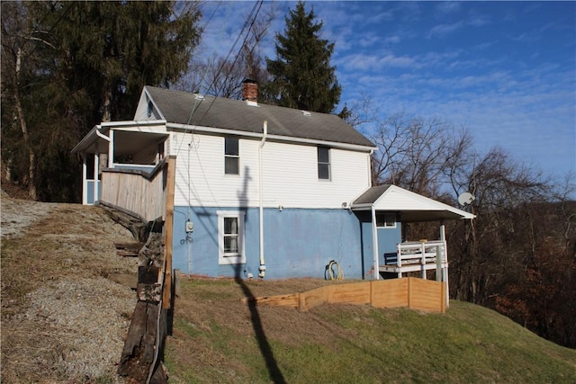 view of side of home featuring a yard