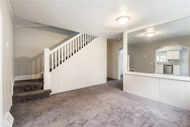 unfurnished living room with carpet