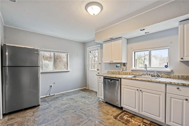 kitchen with white cabinetry, sink, and appliances with stainless steel finishes