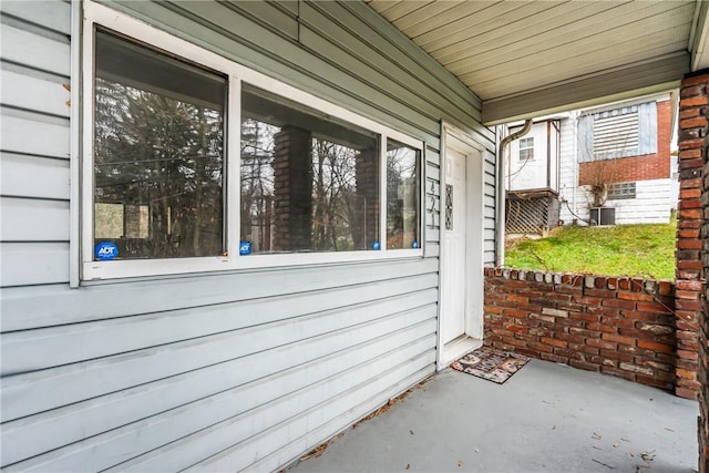 view of patio with covered porch and central air condition unit